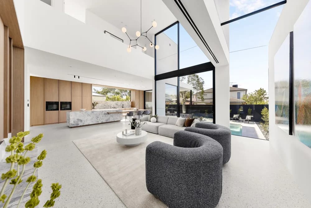 Double-height living room and stone kitchen at The Stonehouse