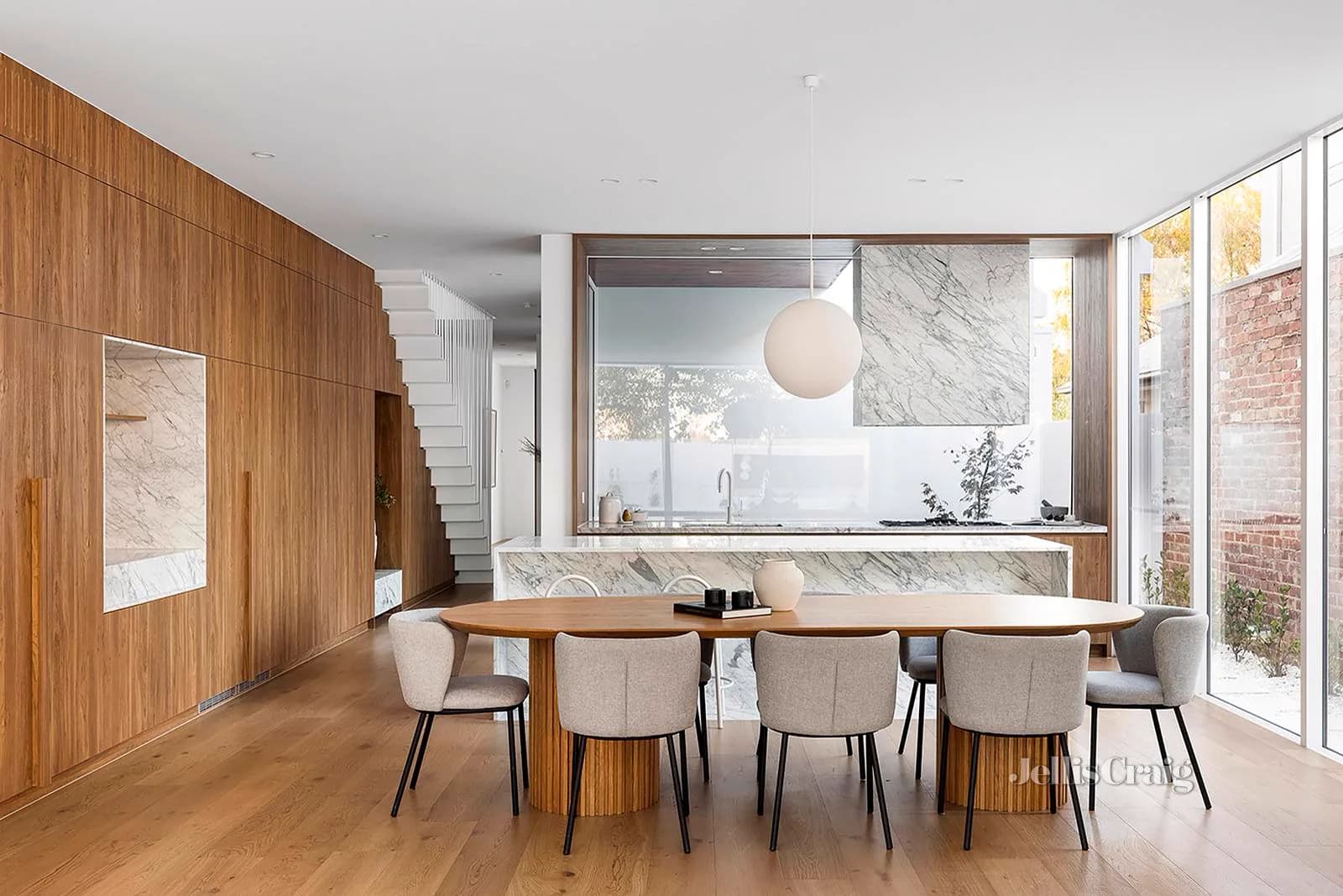 Timber-lined dining room and marble kitchen at Brooks Garden House